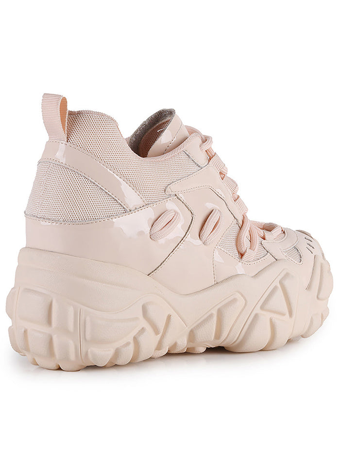 Three-quarter studio view of Anthony Wang PERSIMMON 01 Neutral Vibes Nude platform sneakers detailing the secure lace-up closure layout, silver eyelets, and chunky rounded toe cap