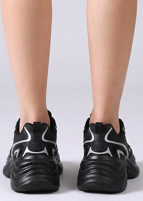 Berness Petra Tektronic Black Platform Sneakers in black with metallic silver strip detailing on chunky platform sneaker — back view, on foot