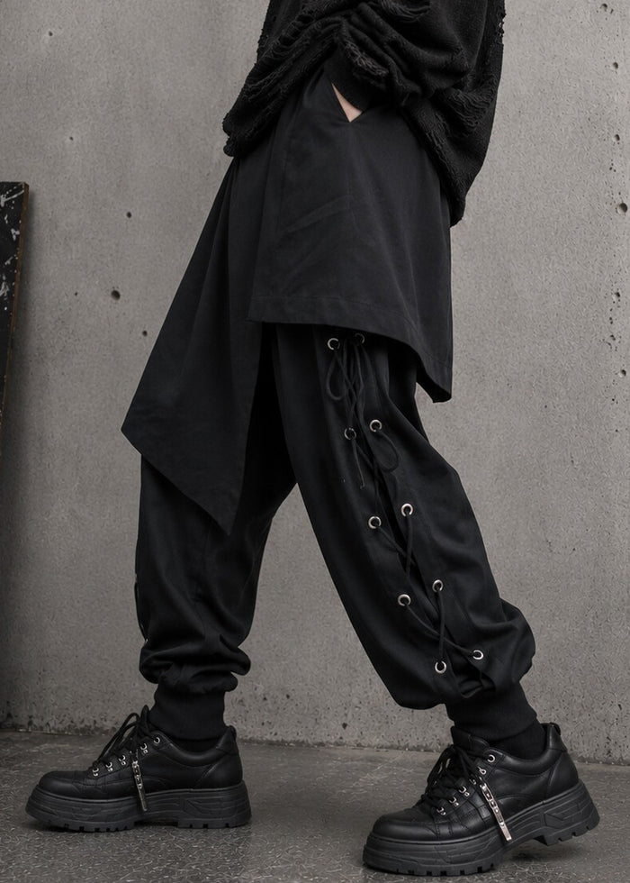 Resham Punk Goth Detachable Harem Pants in black with removable eyelet lace-up skirt harness on pants — side on model