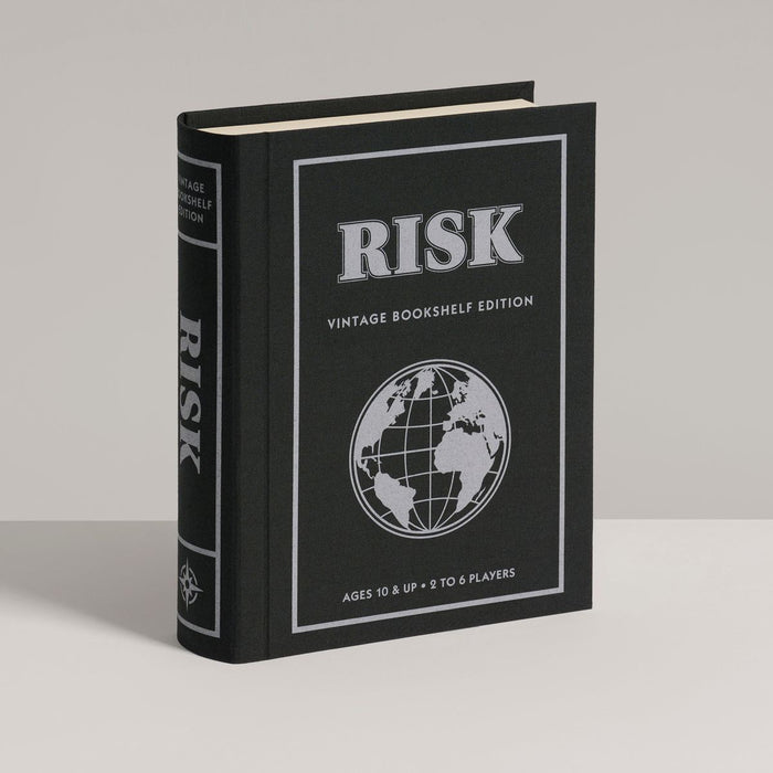 Black book titled 'Risk' with a globe illustration on a gray background