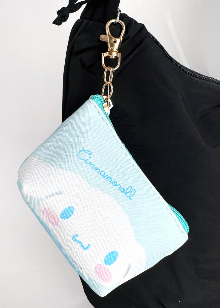 Sanrio Cinnamoroll Big Face Mini Coin Pouch in blue with full-front Cinnamoroll face on soft plush mini coin pouch — detail view