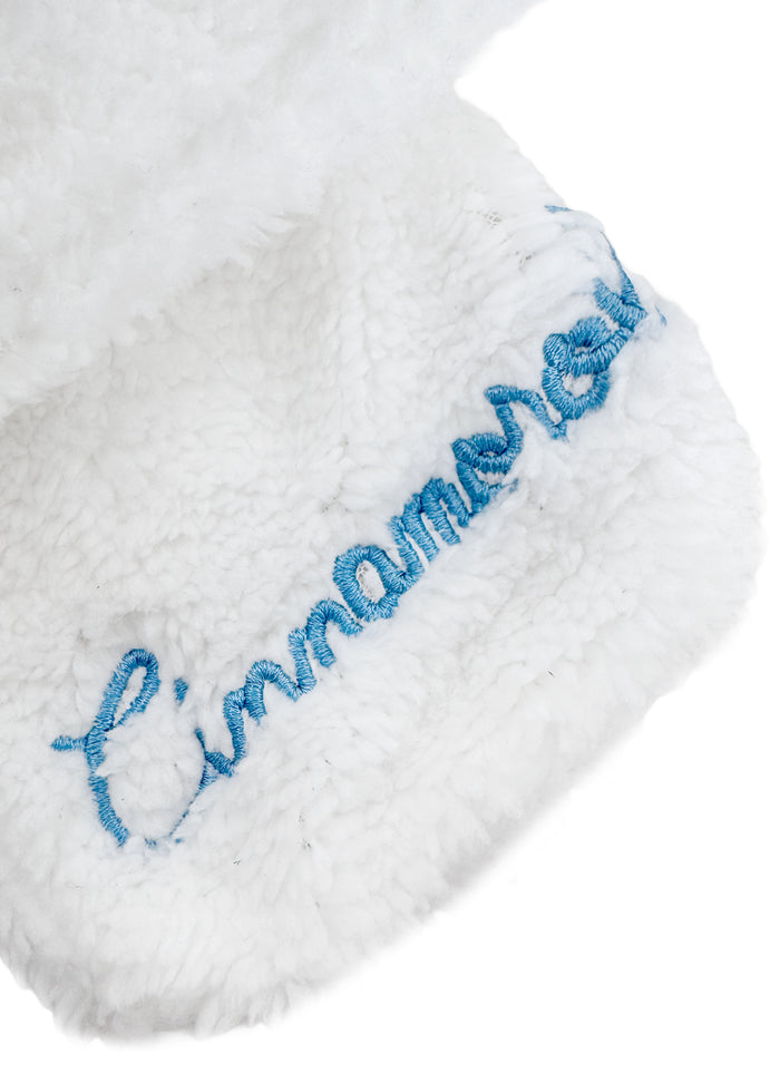 Sanrio Cinnamoroll Plush Muffler Scarf in white with Cinnamoroll plush face on knit muffler rave winter accessory — texture detail view