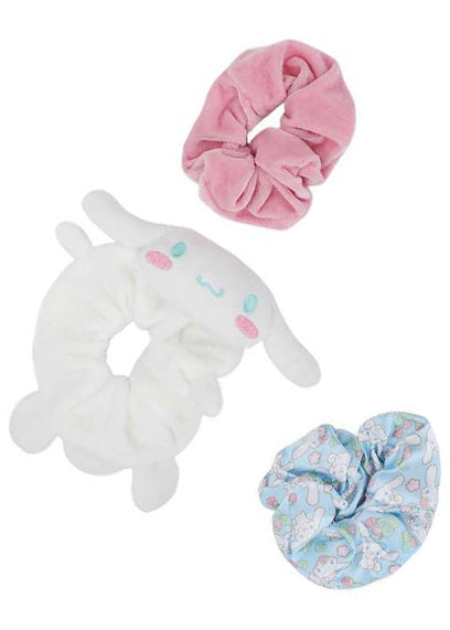 Bioworld Sanrio Cinnamoroll Scrunchies 3 Pack Set in white multi with 2 satin AOP scrunchies and 1 plush Cinnamoroll face scrunchie on kawaii rave hair accessories — front view