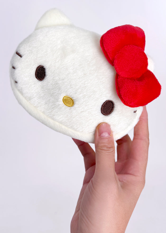 Sanrio Hello Kitty 70s Series Plush Red Cosmetic Bag in red with retro 70s Hello Kitty plush design on rave festival makeup bag — model view