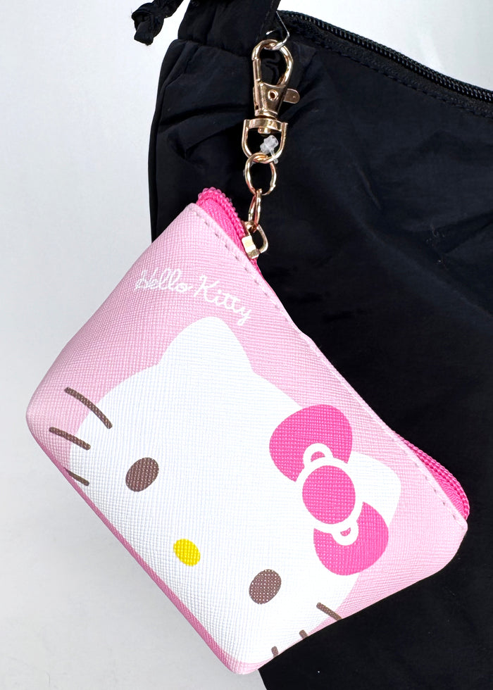 Sanrio Hello Kitty Big Face Mini Coin Pouch in pink with full-front Hello Kitty face on soft plush mini coin pouch — detail view