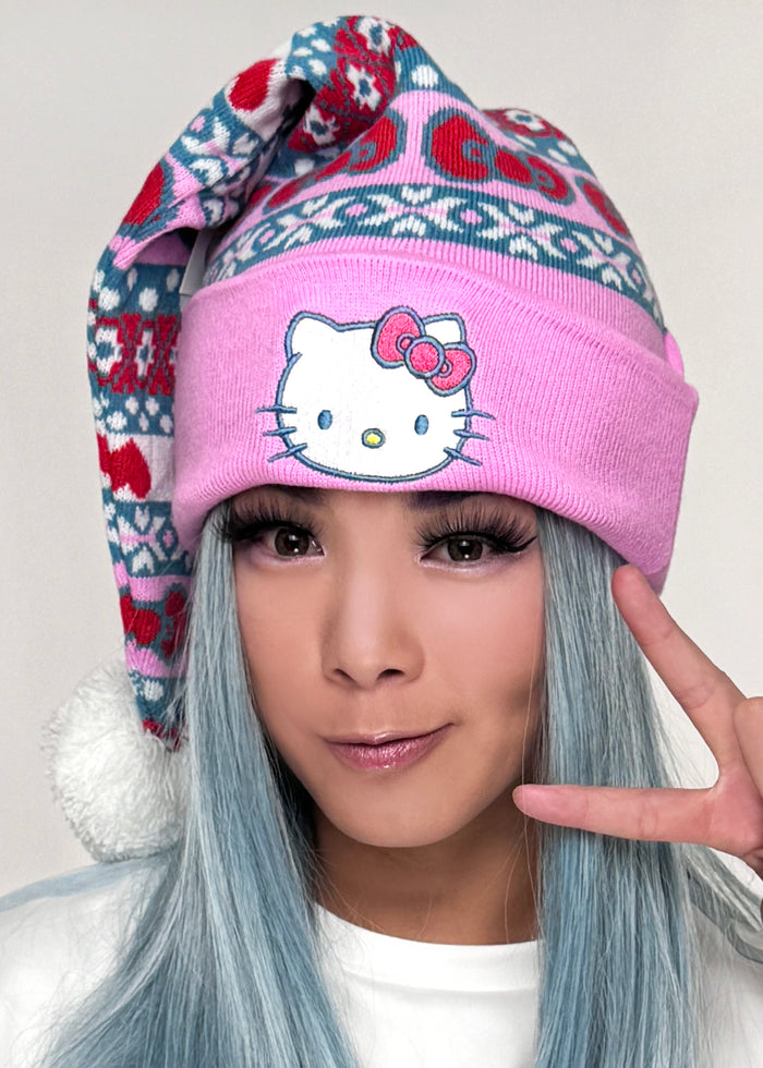 Bioworld Sanrio Hello Kitty Jacquard Santa Hat in multi — model side view