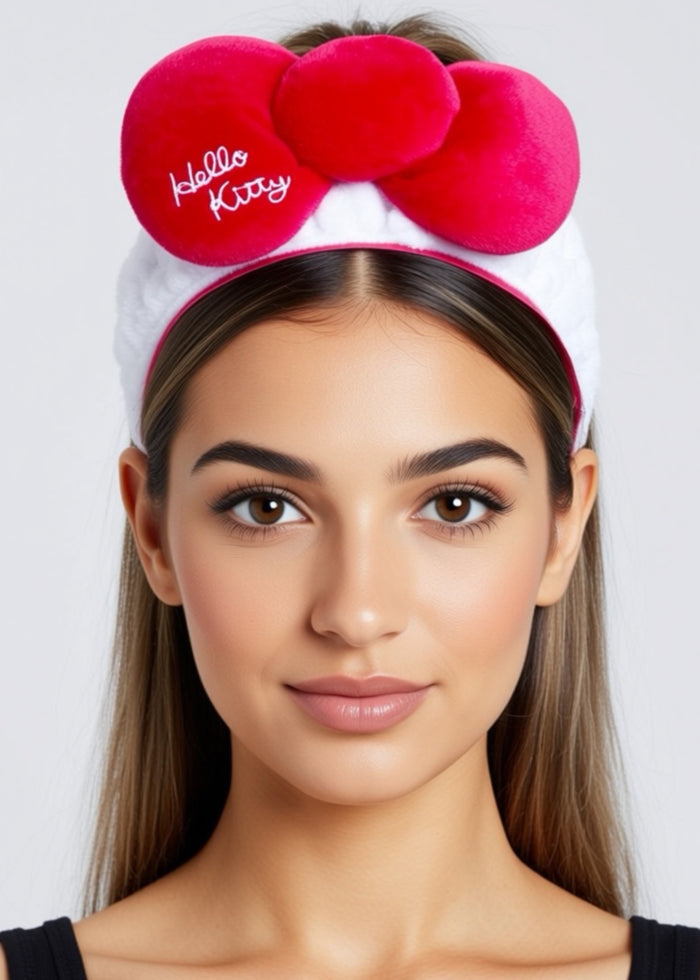 Sanrio Hello Kitty Plush Bow Hair Band in white with Hello Kitty signature red bow in plush form on stretchy hair band — model view