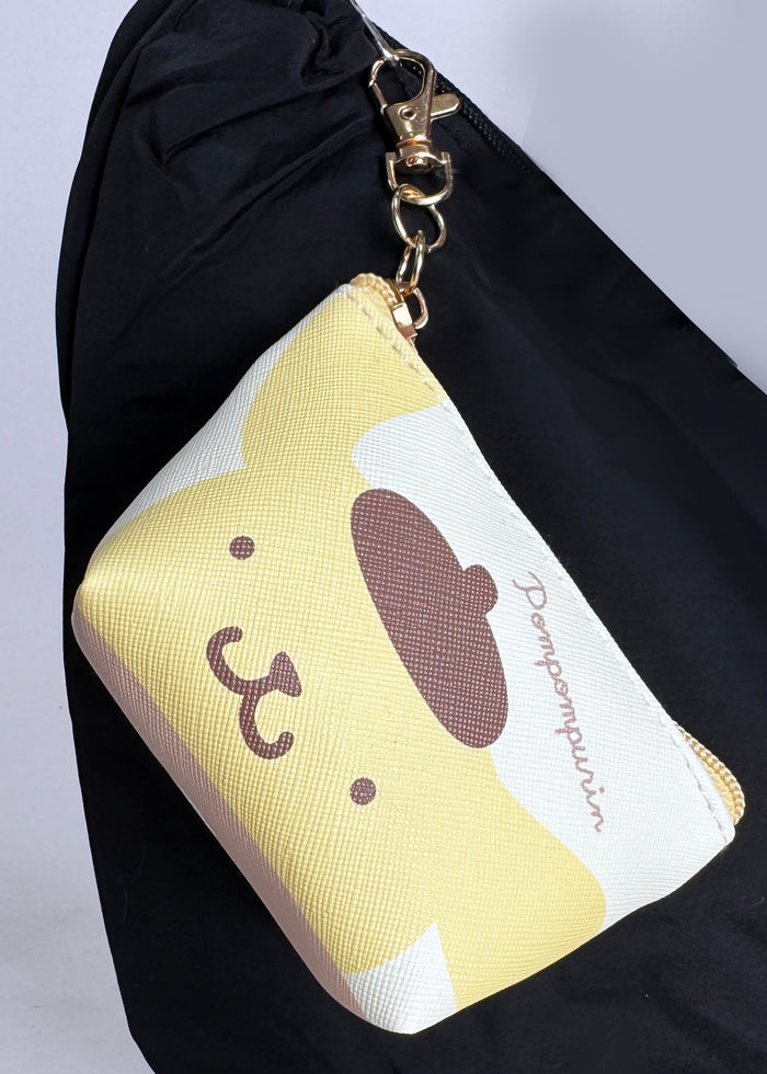 Sanrio Pompompurin Big Face Mini Coin Pouch in yellow with full-front Pompompurin face on soft plush mini coin pouch — detail view