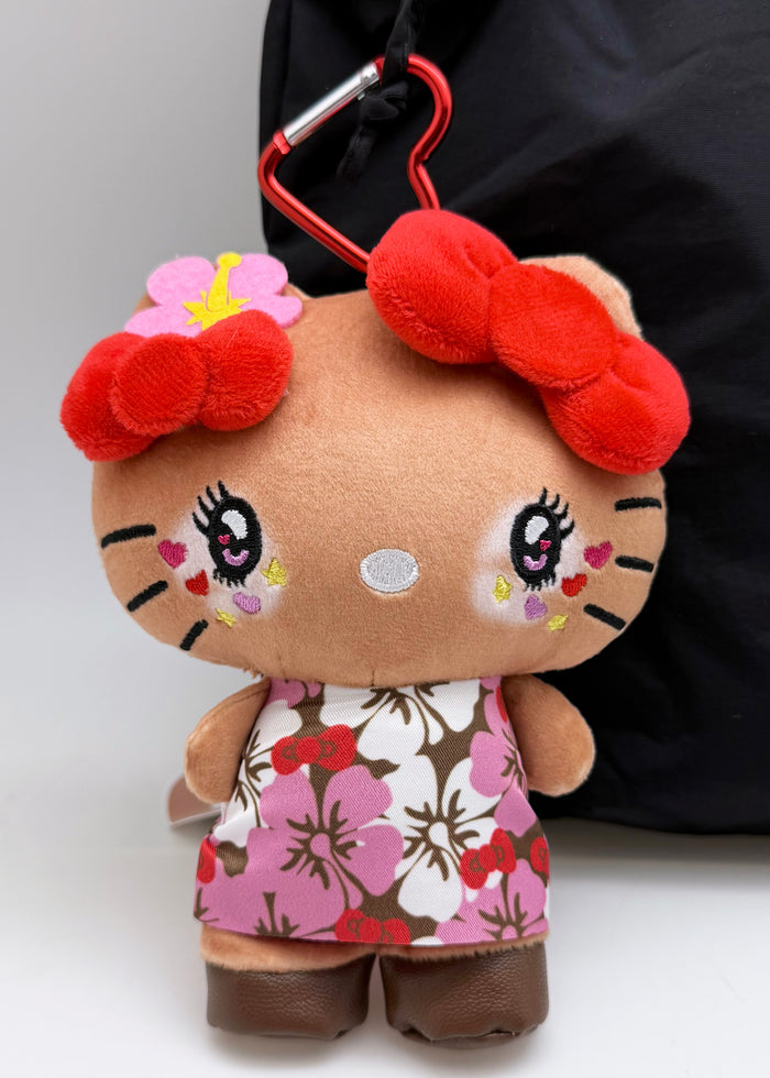 Sanrio Tanned Hello Kitty Hibiscus Plush Mascot Carabiner in multi with tanned Hello Kitty in hibiscus floral design on plush carabiner rave accessory — model view