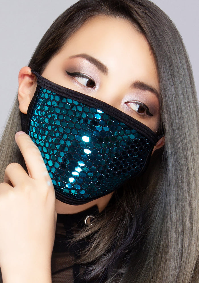 BGlittz Sapphire Party Dust Mask in metallic blue turquoise with shiny honeycomb cut-out on breathable nylon rave festival face mask — model front view