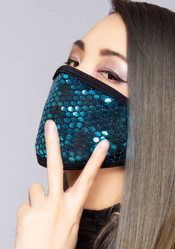 BGlittz Sapphire Party Dust Mask in metallic blue turquoise with shiny honeycomb cut-out on breathable nylon rave festival face mask — model side view