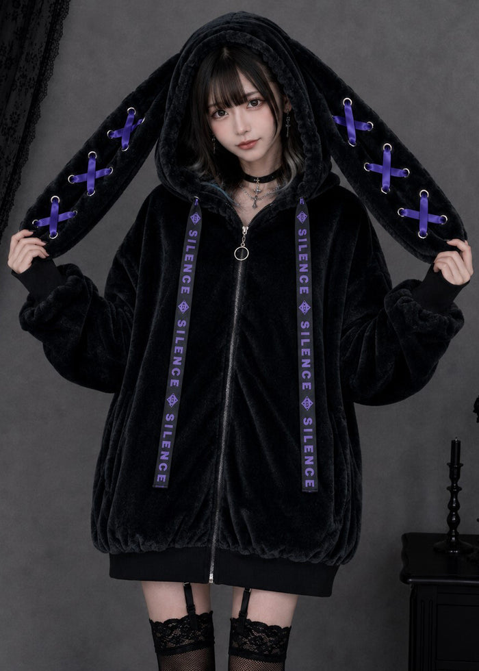 Resham Silence Bunny Ear Black Purple Faux Fur Oversized Jacket in black with purple lace-up bunny ear hood on jacket — front on model
