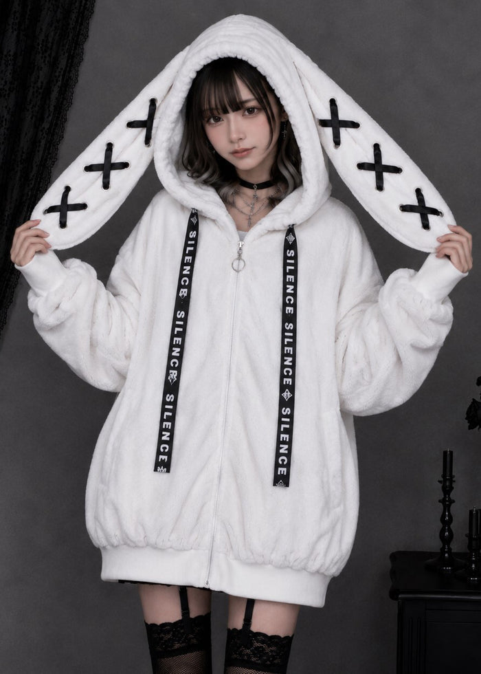 Resham Silence Bunny Ear White Black Faux Fur Oversized Jacket in white with black lace-up bunny ear hood on jacket — front on model