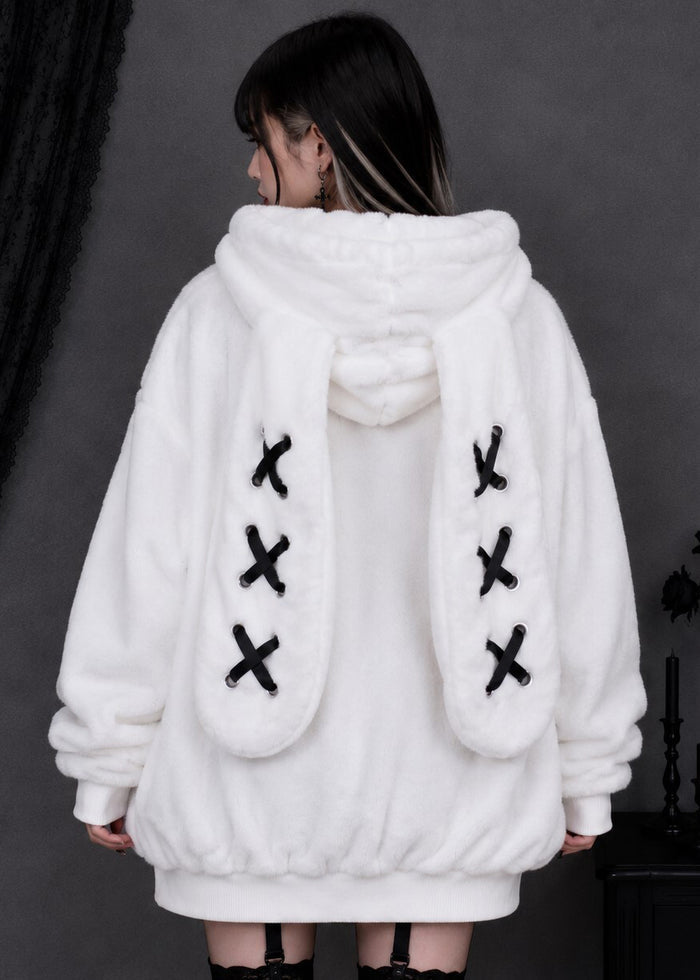 Resham Silence Bunny Ear White Black Faux Fur Oversized Jacket in white with black lace-up bunny ear hood on jacket — back on model