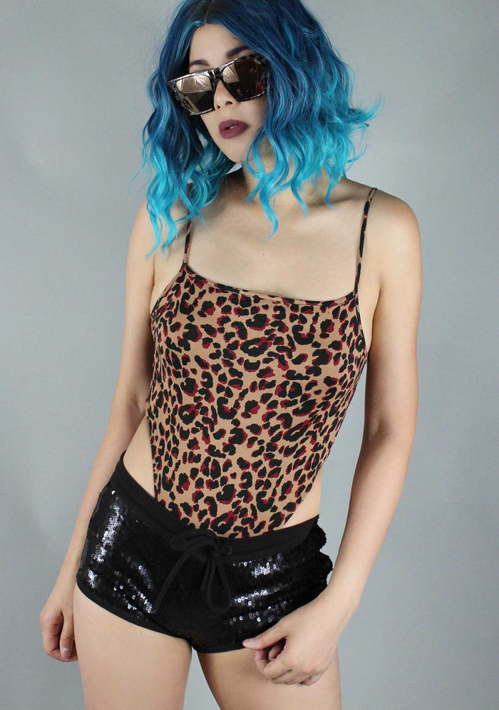 Motel Rocks Solemo Jungle Leopard Bodysuit in brown with all-over leopard print graphic and spaghetti straps on rave bodysuit — model view