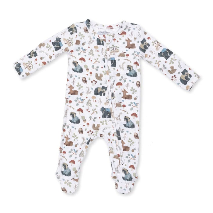 A baby long-sleeve footed sleeper with an all-over woodland animal print on a white background. The print features bears, deer, squirrels, and trees in muted earthy tones.
