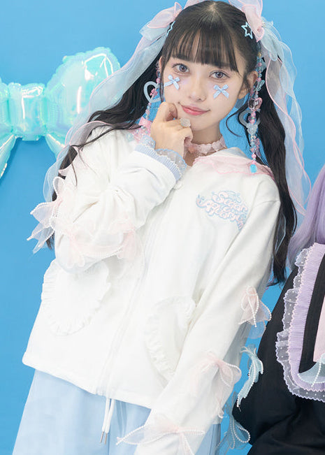 ACDC Rag Sugar Aquarium Sailor White Blue Zip Up Jacket in white with sheer pearl-trimmed bow ties on rave festival jacket — worn front view