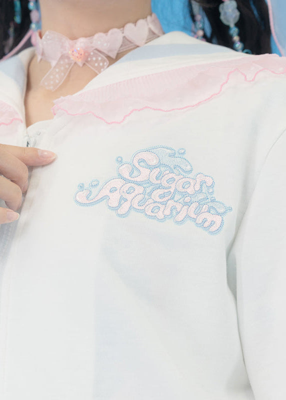 ACDC Rag Sugar Aquarium Sailor White Blue Zip Up Jacket in white with embroidered Sugar Aquarium chest logo on rave festival jacket — embroidery detail