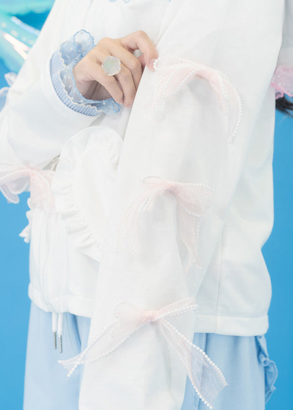 ACDC Rag Sugar Aquarium Sailor White Blue Zip Up Jacket in white with pearl-trimmed bow cuff detail on rave festival jacket — cuff bow detail