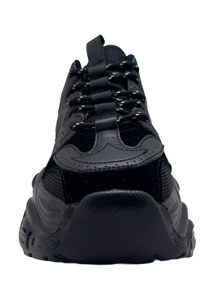Berness SUNNY Blackout Pulse Black Rave Platform Sneakers in black vegan leather with chunky platform sole and lace-up closure worn by model — front view