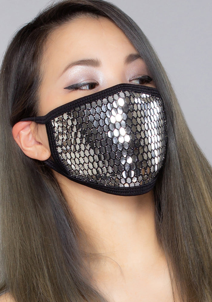 BGlittz Techno Dust Mask in metallic silver with honeycomb cut-out detail on breathable nylon rave festival face mask — model view