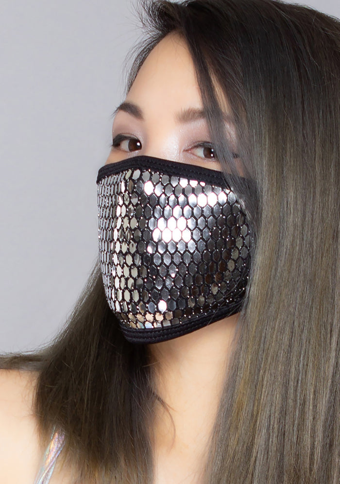 BGlittz Techno Dust Mask in metallic silver with honeycomb cut-out detail on breathable nylon rave festival face mask — model side view