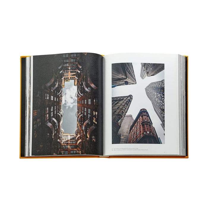Open book showing cityscape images on a white background