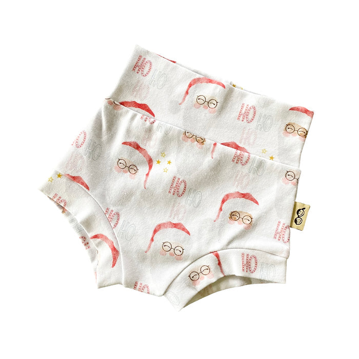 Vintage Santa bummies with a high-waisted design, featuring a festive red and white Santa Claus print. Handmade diaper cover for babies and toddlers, perfect for holiday celebrations and seasonal outfits.