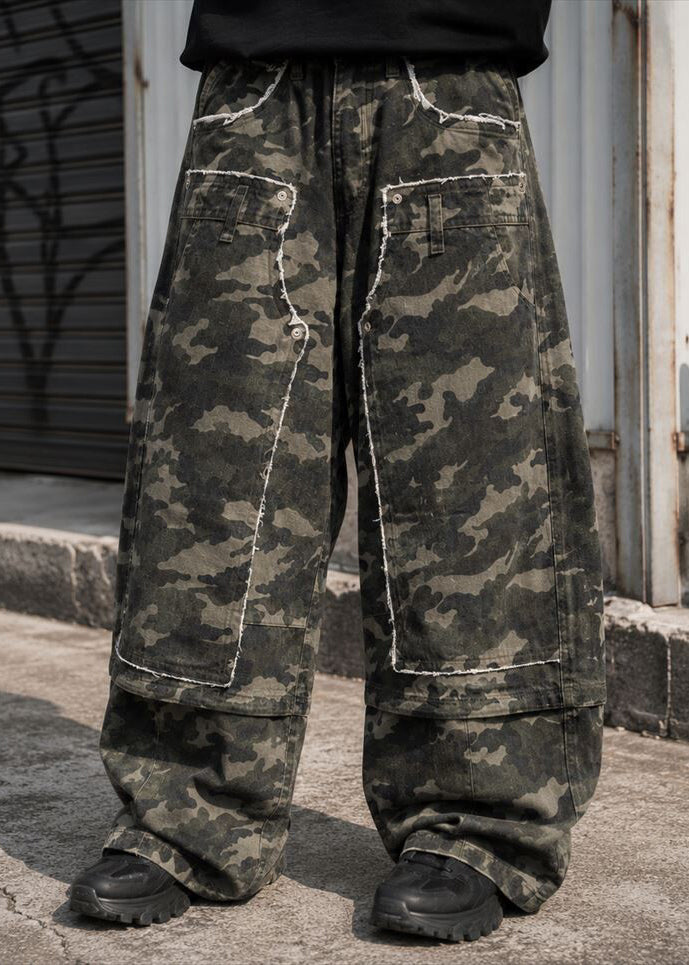 Suggestion Wasteland Camo Patchwork Baggy Pants in camo print with raw-edge patchwork panel on baggy pants — front on model