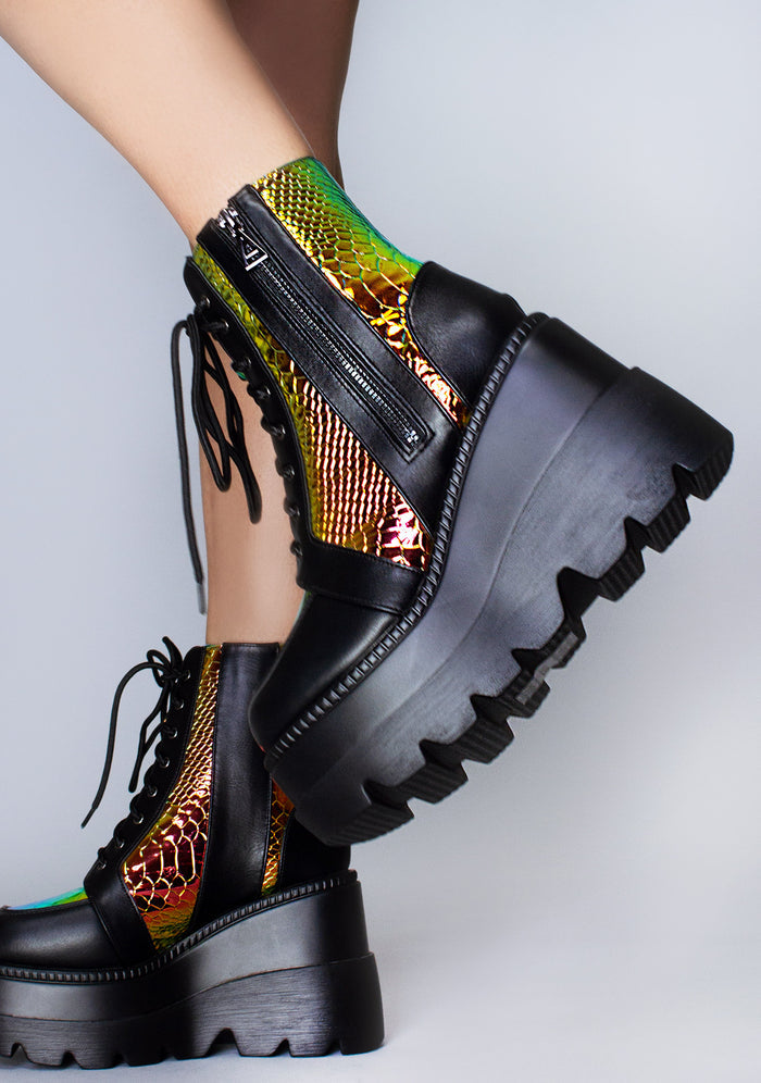 Side profile view of the exclusive Radioactive rave platform boots, highlighting the vivid contrast of the shimmering orange-gold iridescent python side panels.