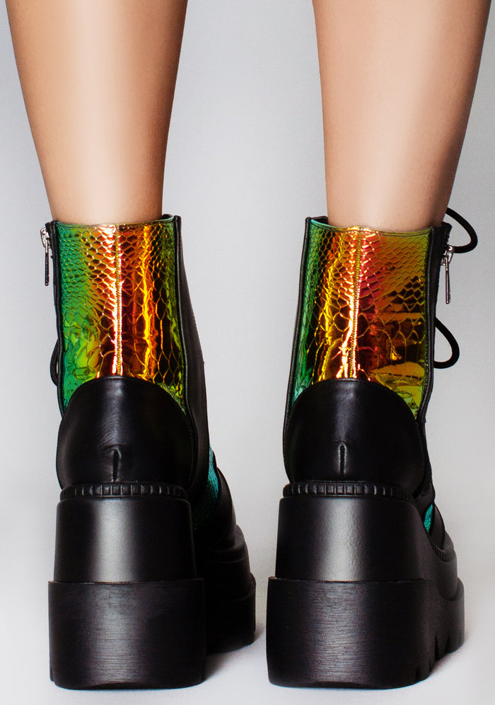 Rear view of the Radioactive festival boots on-model, detailing the structured high-top ankle fit, clean back panel stitching, and the 4.5-inch stacked block heel.