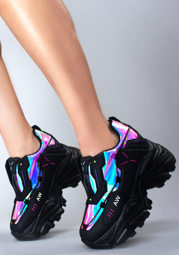 On-foot side profile styling of Anthony Wang X LASR Exclusive Neuromancer black platform sneakers showcasing the vibrant iridescent paneling and thick block sole