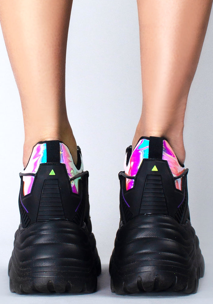Rear studio view from behind of Anthony Wang X LASR Exclusive Watermelon 04 Neuromancer black platform sneakers showcasing the detailed heel guards and high-traction outsole