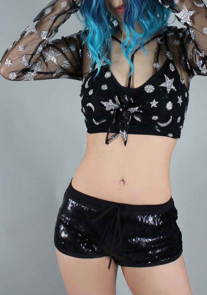 Motel Rocks Yun Star Child Crop Top in black silver with glitter star and moon detail on sheer festival top — model view